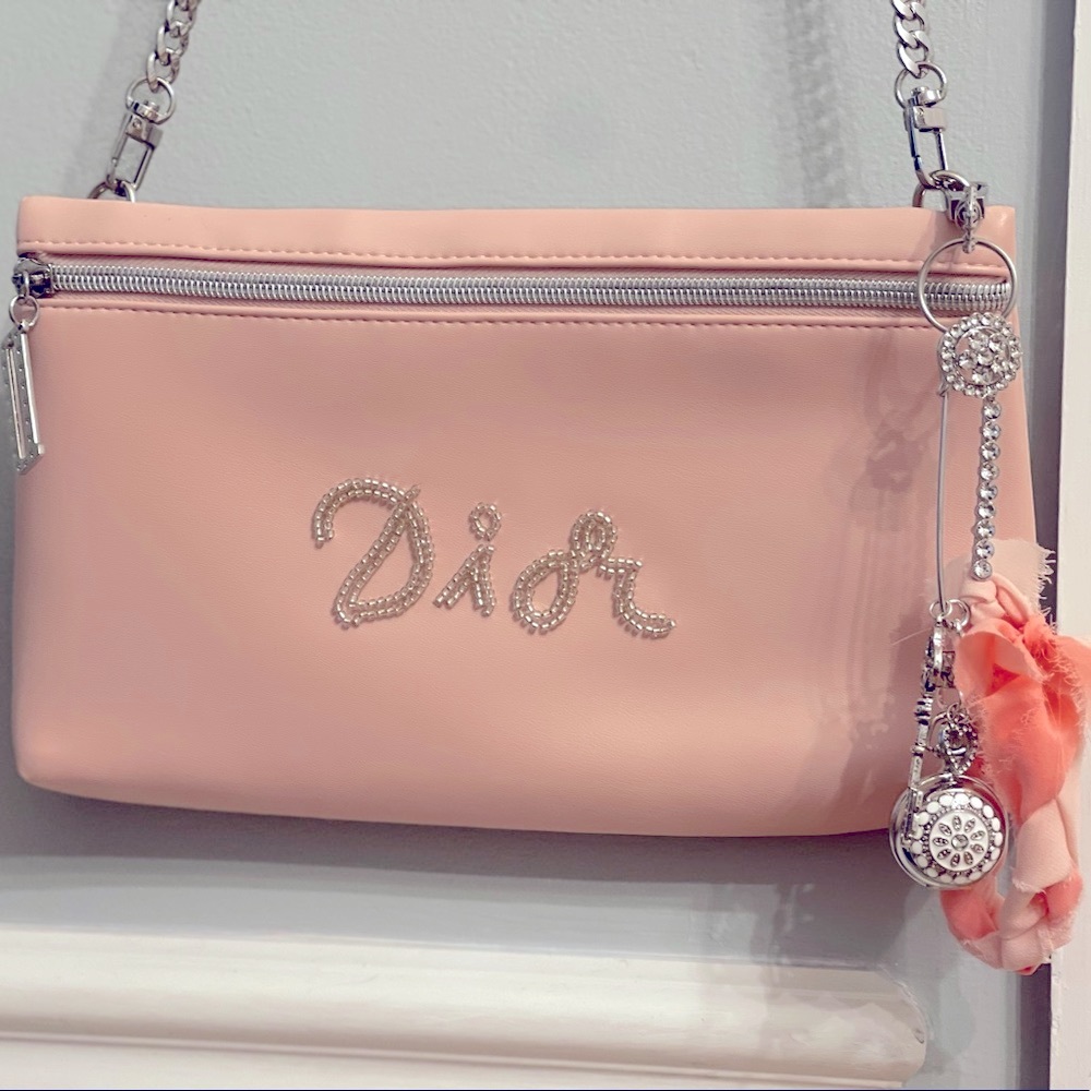 Dior authentic light pink silver chain shoulder purse with beaded “Dior”.